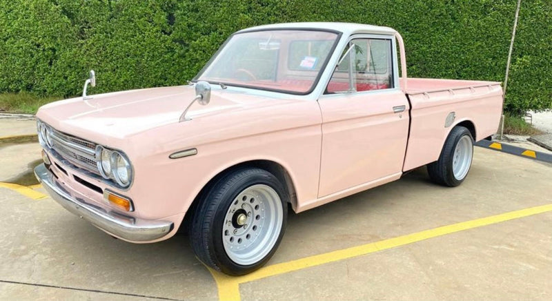 1971 Datsun 521 Pickup side profile with pink paint