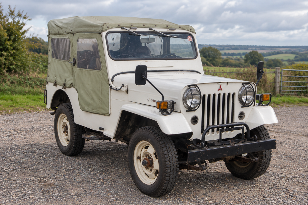 1976 Mitsubishi Jeep J54 front three-quarter with khaki canvas hood