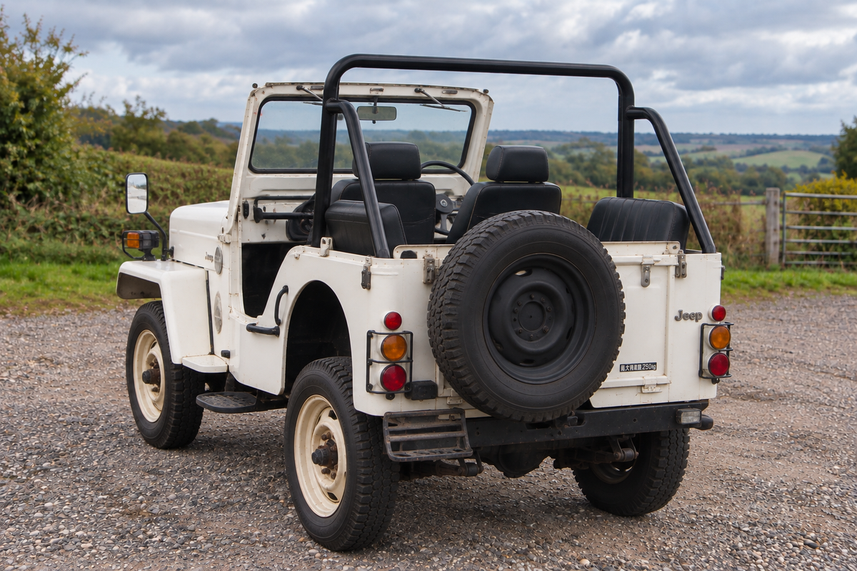 1976 Mitsubishi Jeep J54 rear three-quarter, open top with roll bar